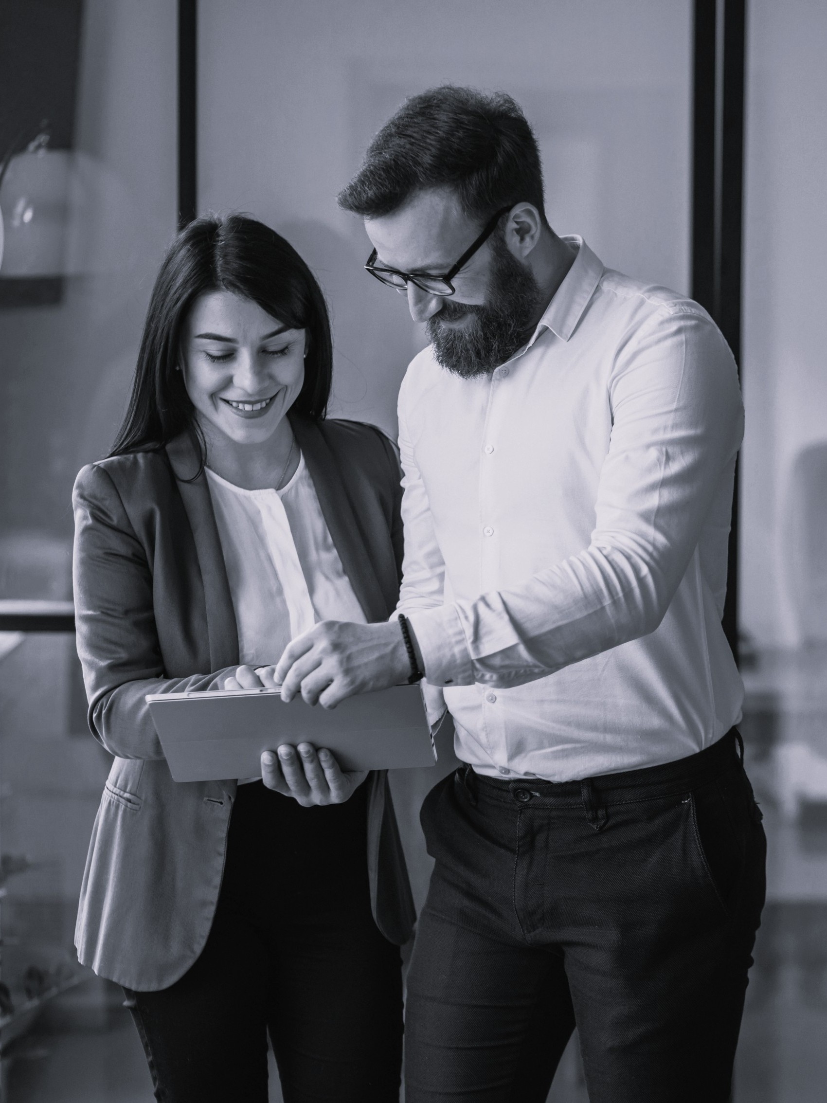 Business partners closing IT sales deals in office